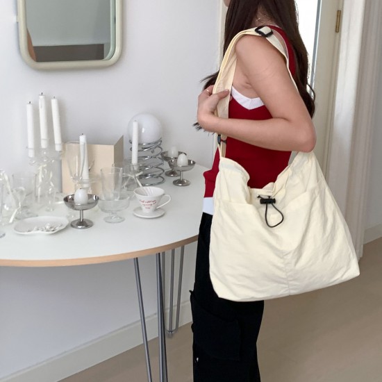 Lazy style lightweight nylon bag, versatile pocket drawstring shoulder bag, casual large capacity tote bag, commuting crossbody bag