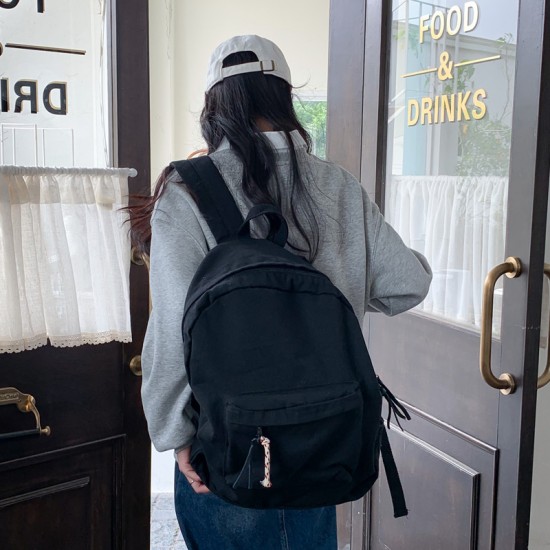 Japanese and Korean style washed canvas backpack with small floral rope, simple, fashionable, retro, versatile, and artistic style.