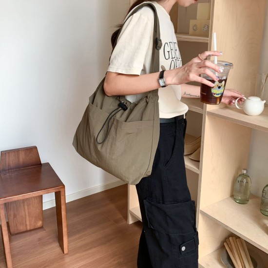 Lazy style lightweight nylon bag, versatile pocket drawstring shoulder bag, casual large capacity tote bag, commuting crossbody bag