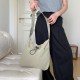 Lazy style lightweight nylon bag, versatile pocket drawstring shoulder bag, casual large capacity tote bag, commuting crossbody bag