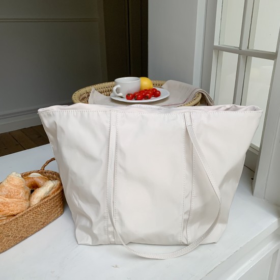 Korean high-end drawstring tote shoulder bag, stylish, large capacity, shopping bag, nylon, simple and suitable for commuting.