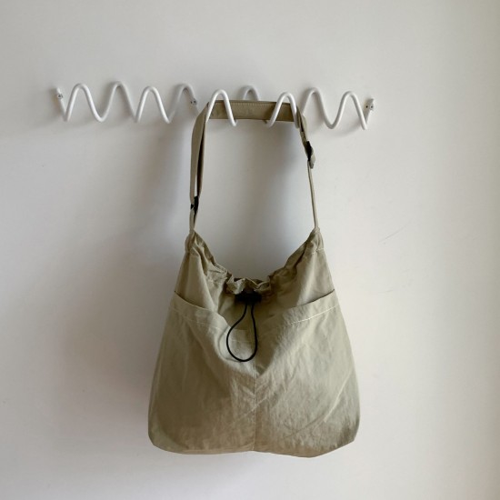 Lazy style lightweight nylon bag, versatile pocket drawstring shoulder bag, casual large capacity tote bag, commuting crossbody bag